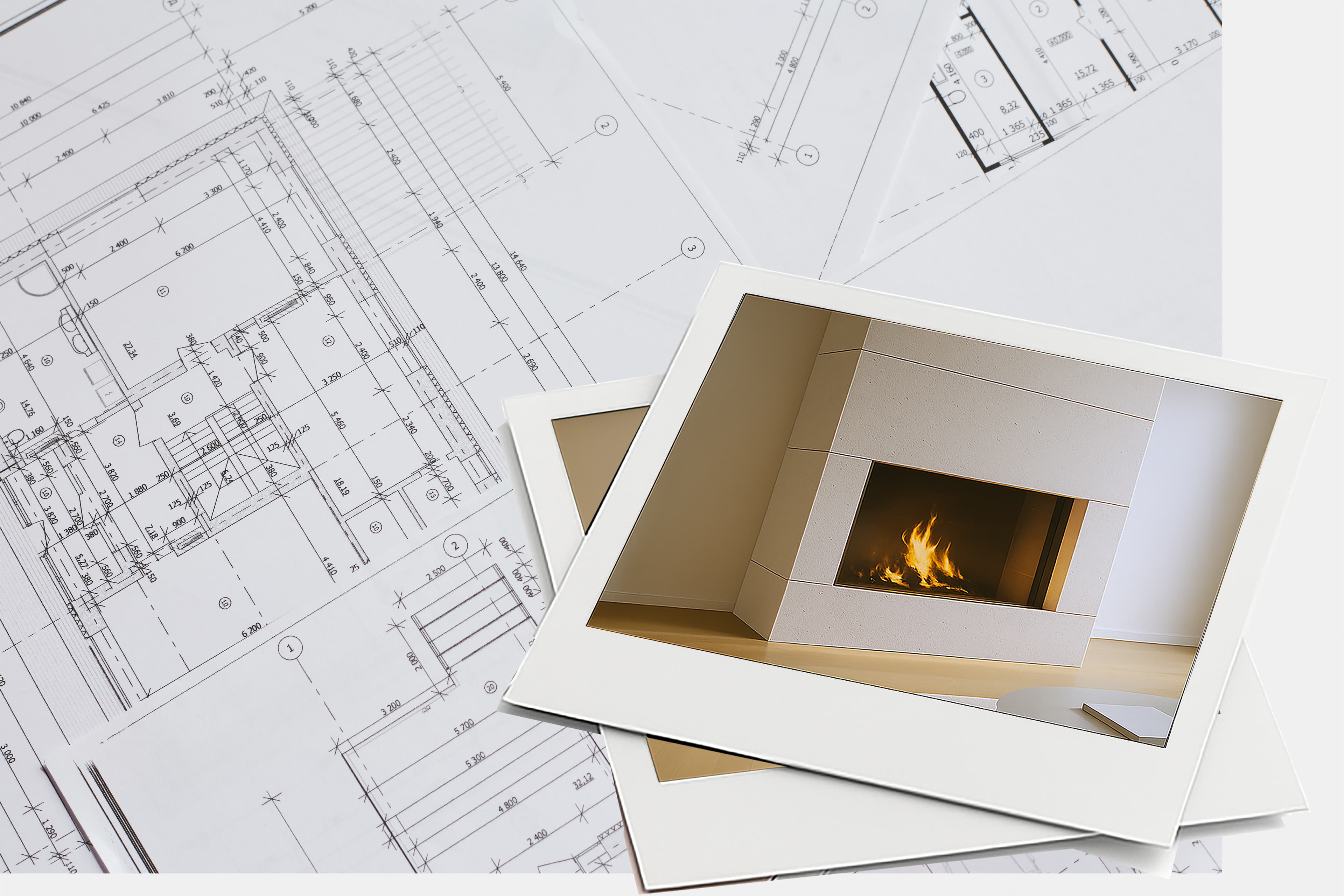 Zwei gedruckte Fotos eines modernen Kamins sind auf architektonischen Entwürfen platziert und verbinden so die Inspiration für die Inneneinrichtung mit den Bauplänen.