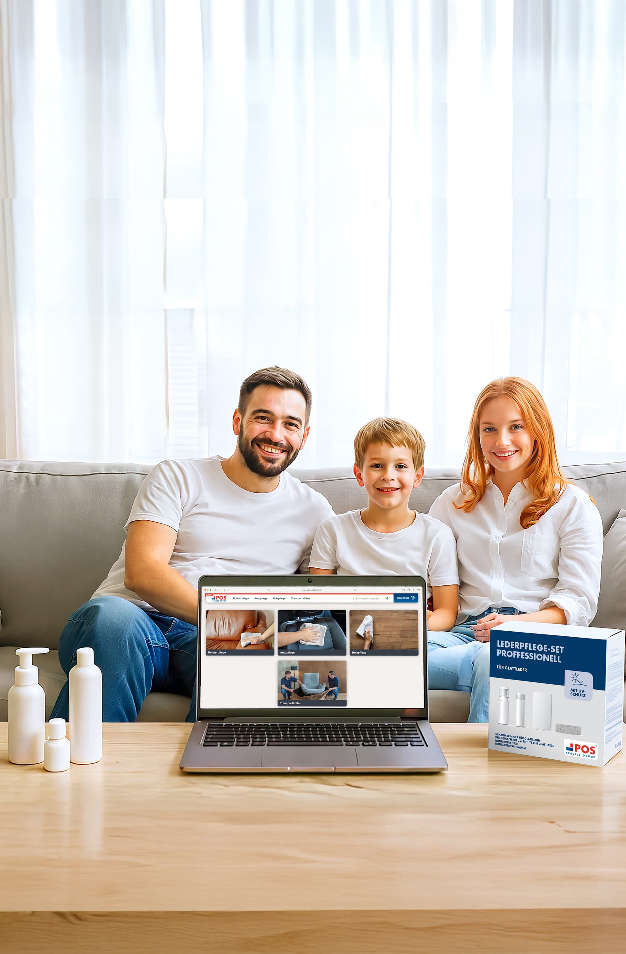 A smiling family of three sits on a couch behind a coffee table with lotion bottles, a laptop displaying cleaning products, and a cleaning kit box. A sheer curtain lets in natural light behind them.